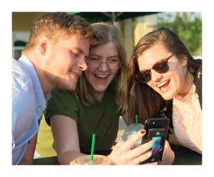 The Graphite Lab co-founder and co-president Jacob Nolley, left, demonstrates (with friends) how to use the GripIt while taking a selfie with a mobile phone or device.