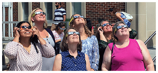Libraries staff checking out the solar eclipse 2017