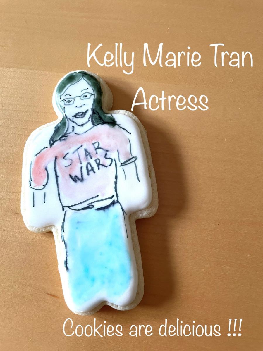 Cookies of Role Models example image. Cookie depicts the actress Kelly Marie Tran. The picture includes a statement that the 'Cookies are delicious'.