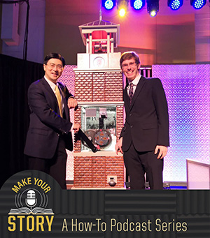 Profile picture of Matt Fitzgerald with Purdue University President, Mung Chiang, and the standing bell tower replica penny press 