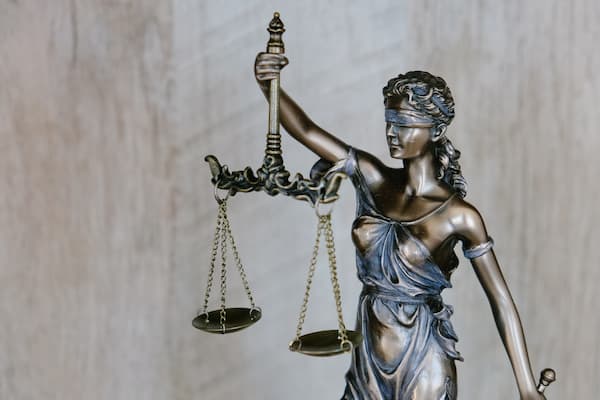 Picture of a statue holding scales of justice